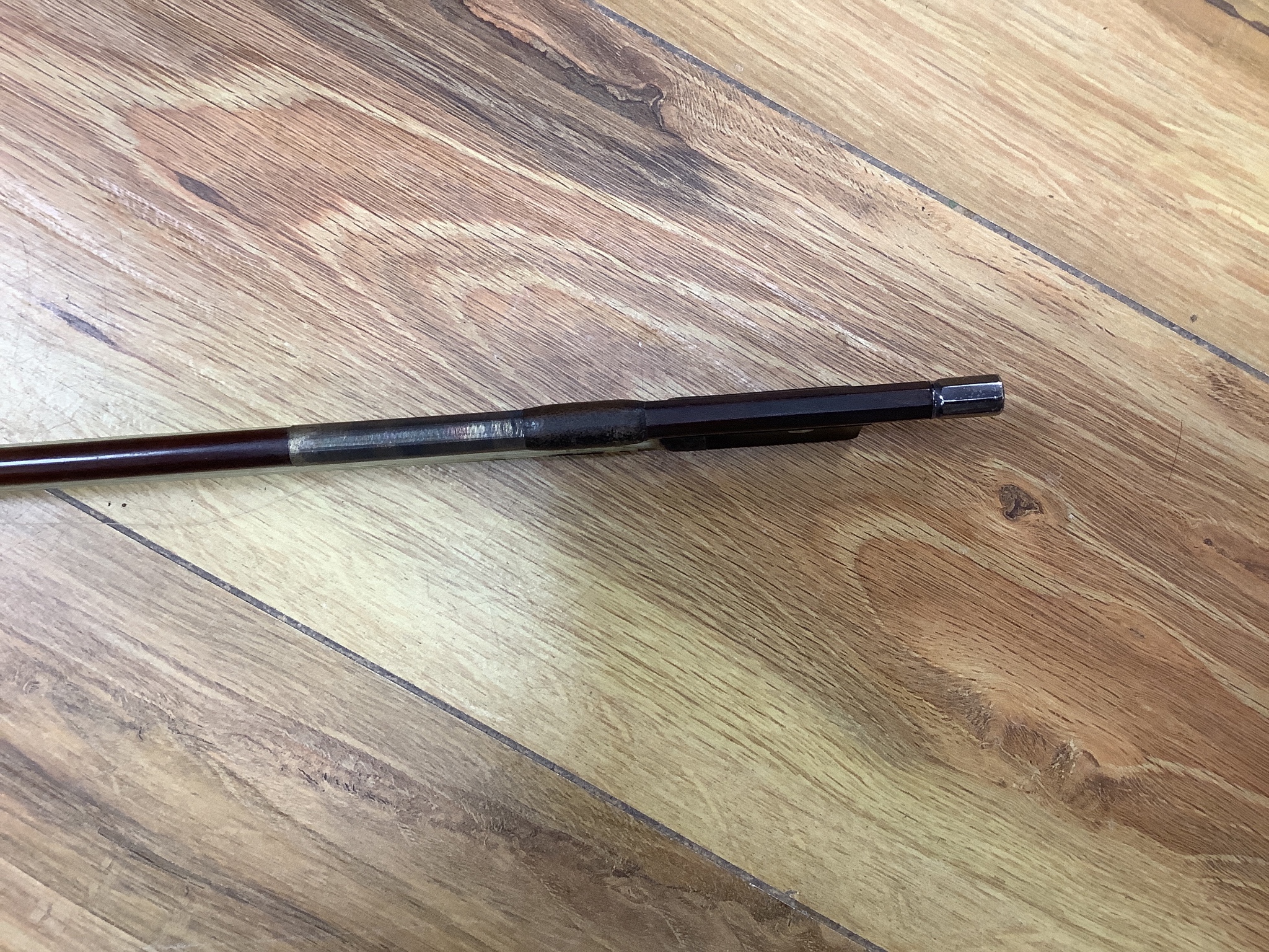 A cased violin and bow